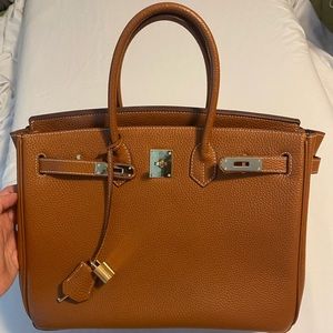Cowhide leather purse- similar to Hermès
Gold Togo Birkin 30 Palladium Hardware